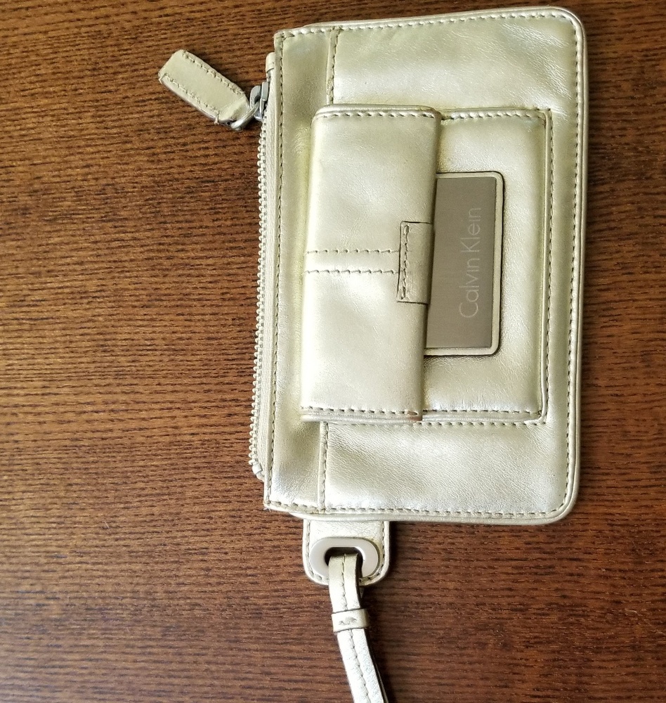 CALVIN KLEIN gold metallic LEATHER wristlet. Used